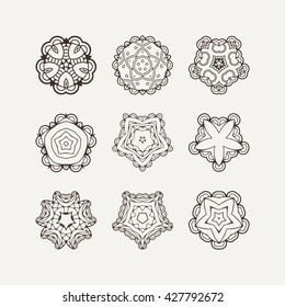 Set of ornate vector mandala symbols. Mehndi lace tattoo. Oriental weave. The circular pattern.