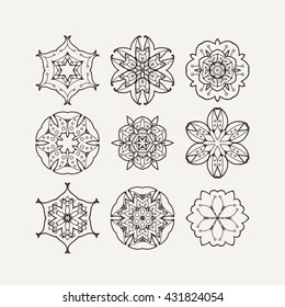 Set of ornate vector mandala symbols. Mehndi lace tattoo. Oriental weave. The circular pattern.