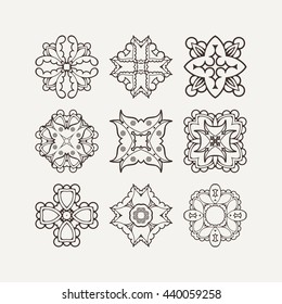 Set of ornate vector mandala symbols. Mehndi lace tattoo. Oriental weave. The circular pattern.