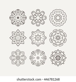Set of ornate vector mandala symbols. Mehndi lace tattoo. Oriental weave. The circular pattern.
