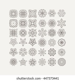 Set of ornate vector mandala symbols. Mehndi lace tattoo. Oriental weave. The circular pattern.