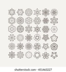 Set of ornate vector mandala symbols. Mehndi lace tattoo. Oriental weave. The circular pattern.