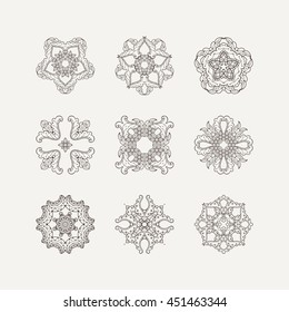 Set of ornate vector mandala symbols. Mehndi lace tattoo. Oriental weave. The circular pattern.