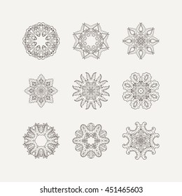Set of ornate vector mandala symbols. Mehndi lace tattoo. Oriental weave. The circular pattern.