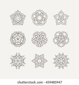 Set of ornate vector mandala symbols. Mehndi lace tattoo. Oriental weave. The circular pattern.