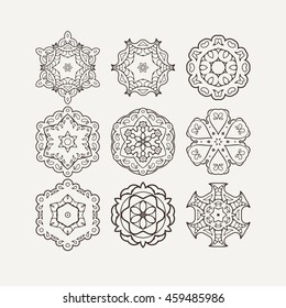 Set of ornate vector mandala symbols. Mehndi lace tattoo. Oriental weave. The circular pattern.