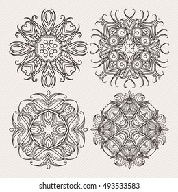 Set of ornate vector mandala symbols. Mehndi lace tattoo. Art Nouveau weave. The circular pattern.