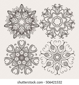 Set of ornate vector mandala symbols. Mehndi lace tattoo. Art Nouveau weave. The circular pattern.