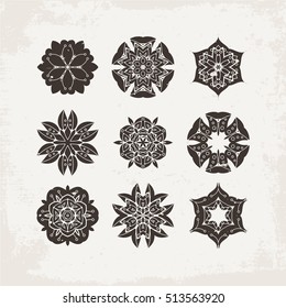 Set of ornate vector mandala symbols. Mehndi lace tattoo. Oriental weave. The circular pattern.