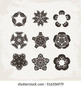 Set of ornate vector mandala symbols. Mehndi lace tattoo. Oriental weave. The circular pattern.