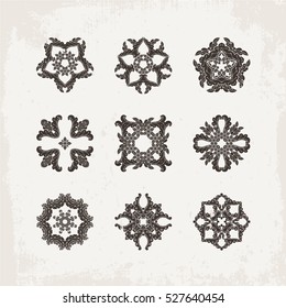 Set of ornate vector mandala symbols. Mehndi lace tattoo. Oriental weave. The circular pattern.