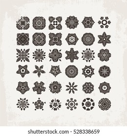 Set of ornate vector mandala symbols. Mehndi lace tattoo. Oriental weave. The circular pattern.