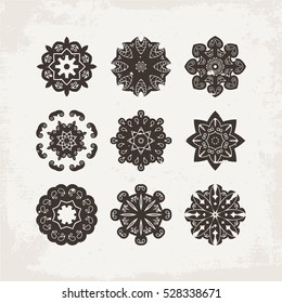 Set of ornate vector mandala symbols. Mehndi lace tattoo. Oriental weave. The circular pattern.