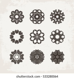 Set of ornate vector mandala symbols. Mehndi lace tattoo. Oriental weave. The circular pattern.