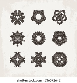Set of ornate vector mandala symbols. Mehndi lace tattoo. Oriental weave. The circular pattern.
