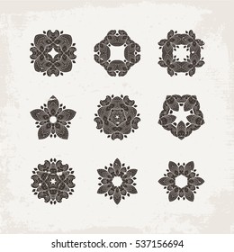 Set of ornate vector mandala symbols. Mehndi lace tattoo. Oriental weave. The circular pattern.