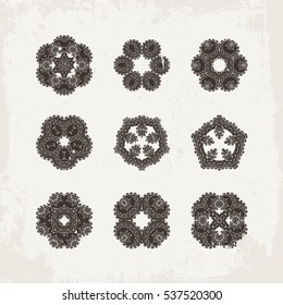 Set of ornate vector mandala symbols. Mehndi lace tattoo. Oriental weave. The circular pattern.