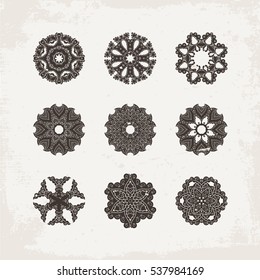 Set of ornate vector mandala symbols. Mehndi lace tattoo. Oriental weave. The circular pattern.