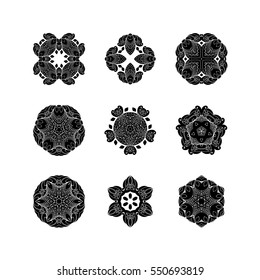 Set of ornate vector mandala symbols. Mehndi lace tattoo. Oriental weave. The circular pattern.
