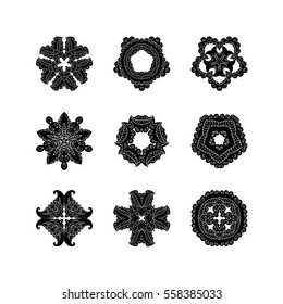 Set of ornate vector mandala symbols. Mehndi lace tattoo. Oriental weave. The circular pattern.