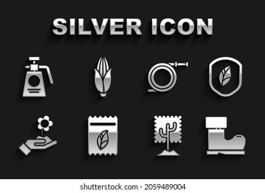 Set Pack full of seeds of plant, Shield with leaf, Waterproof rubber boot, Tree, Hand holding flower, Garden hose or fire hose, sprayer for fertilizer and Corn icon. Vector