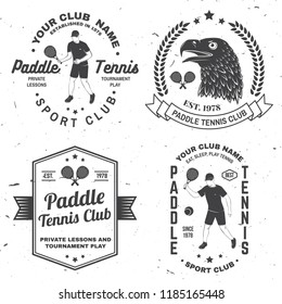 Set of Paddle tennis badge, emblem or sign. Vector illustration. Concept for shirt, print, stamp or tee. Vintage typography design with paddle tennis racket, visor and paddle ball silhouette.