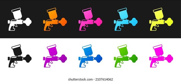 Establece el icono de la pistola de aerosol Paint aislado en el fondo blanco y negro.  Vector
