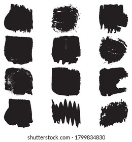 Un conjunto de pinceladas con un cepillo seco. Manchas gruesas negras sobre fondo blanco. Pintura artística negra, dibujada a mano. Colección de elementos de pincel seco