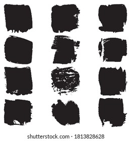 A set of paint strokes with a dry brush. Grunge spots black on white background. Black artistic paint, hand drawn. Dry Brush Stroke elements collection