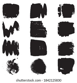 A set of paint strokes with a dry brush. Grunge spots black on white background. Black artistic paint, hand drawn. Dry Brush Stroke elements collection