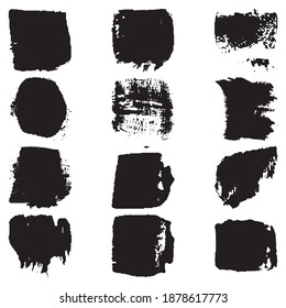 Un conjunto de pinceladas con un cepillo seco. Manchas gruesas negras sobre fondo blanco. Pintura artística negra, dibujada a mano. Colección de elementos de pincel seco