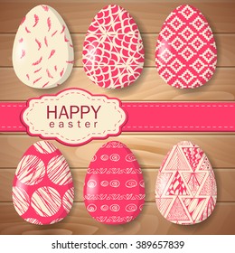 Set of painted Easter eggs on a wooden background. Painted eggs. Abstract patterns.