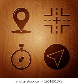 Set Paper airplane, Map pin, Compass and Road traffic sign on wooden background. Vector