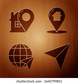 Set Paper airplane, Map pointer with house, Location on the globe and Map pointer with house on wooden background. Vector