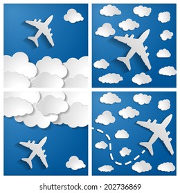 set of paper airplanes with clouds on a blue air background.  Blue sky travel background.