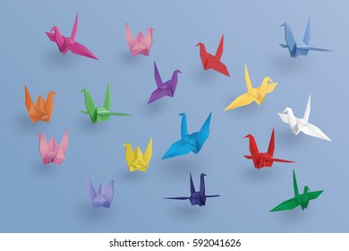 set of paper birds on blue background.the art of origami ;paper art and craft style.