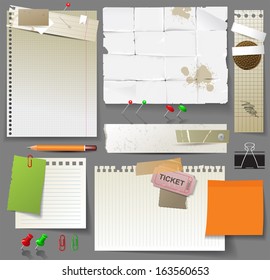 Set of paper and clips over gray background