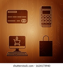 Set Paper shopping bag, Credit card, Shopping cart on screen computer and Pos terminal on wooden background. Vector