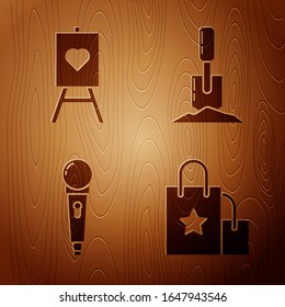 Set Paper shopping bag, Wood easel or painting art boards, Microphone and Shovel in the ground on wooden background. Vector