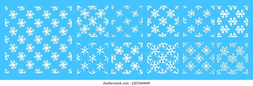 a set of patterns of isolated white snowflakes. seamless pattern of simple doodle snowflakes isolated on blue for winter holidays. doodle pattern snowflake, great design for any purposes.