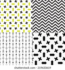 Set of patterns. Set of simple seamless 4 black and white Scandinavian trend seamless pattern - black cross, chevrons, stripes, arrow.