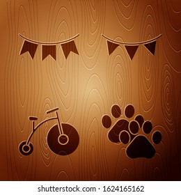 Set Paw print, Carnival garland with flags, Vintage bicycle with one big wheel and one small and Carnival garland with flags on wooden background. Vector