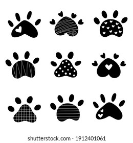 Set pet paw. Silhouette dog paw. Doodle style. Good for posters, t shirts, postcards.