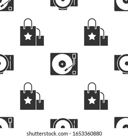 Set Photo camera, Vinyl player with a vinyl disk and Paper shopping bag on seamless pattern. Vector