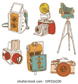 Set of Photo Cameras - hand-drawn doodles in vector