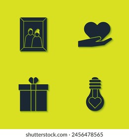 Set Picture frame, Heart shape in light bulb, Gift box and heart and hand icon. Vector