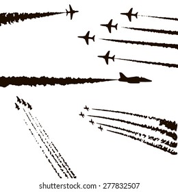 Set of planes. Black silhouettes. The trail of the aircraft.