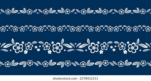 Set of plant borders. Seamless border of floral element. White flowers on dark blue background. Flowers and leaves in shades of blue. Romantic graceful vector ornament. Vintage embroidered ribbon