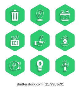 Set Plant in hand, Light bulb with leaf, Wind turbine, Apple core, Eco shop, Leaf symbol, Recycle and Trash can icon. Vector