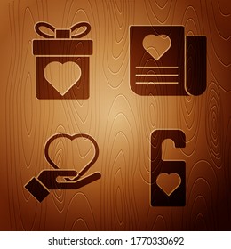 Set Please do not disturb with heart, Gift box with heart, Heart on hand and Envelope with Valentine heart on wooden background. Vector